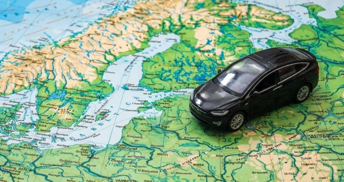 Toy car placed on a map of Europe, symbolizing road travel across EU countries