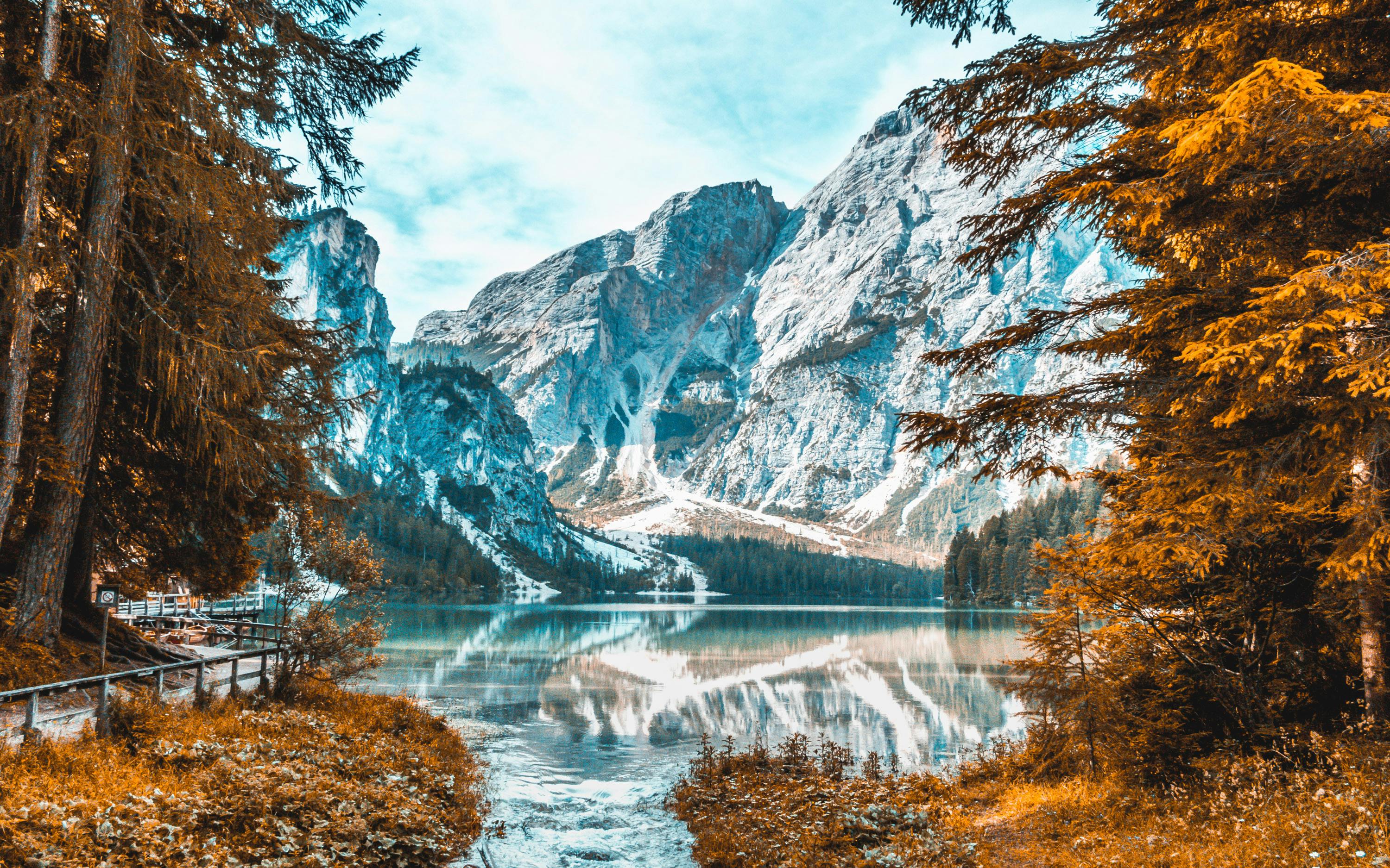 Snowy Dolomites and lake in Veneto