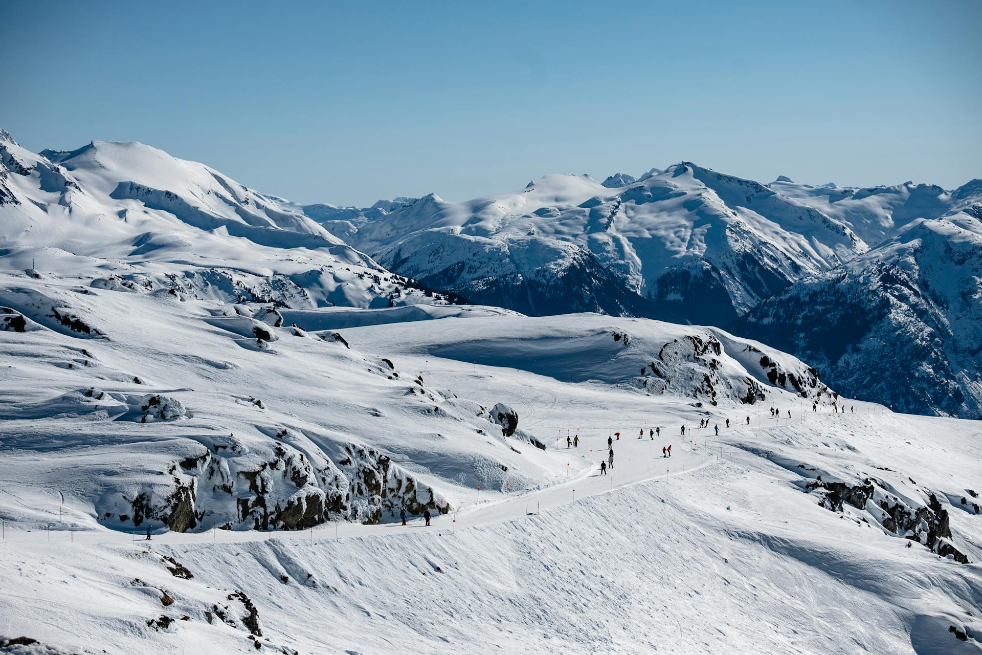 People skiing in snowy mountain of Whistler, Canada